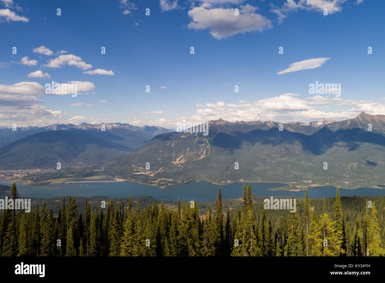 Beautiful snow covered mountains, river and forest Stock Photo - Alamy