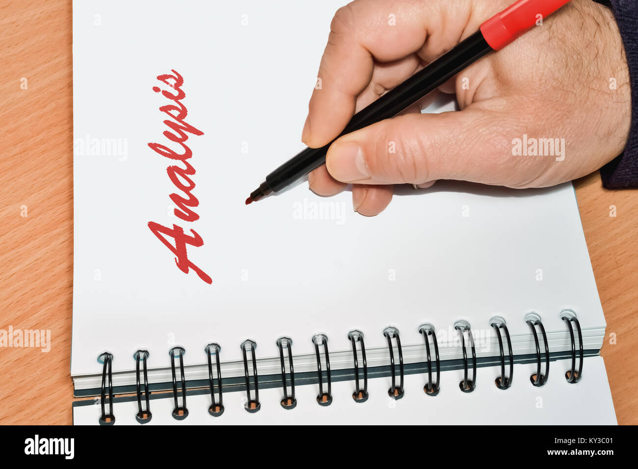 Closeup of a notebook and handwritten word Analysis in red color Stock Photo