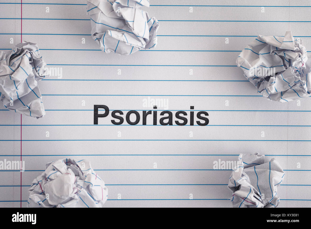 Psoriasis. Word Psoriasis on notebook sheet with some crumpled paper