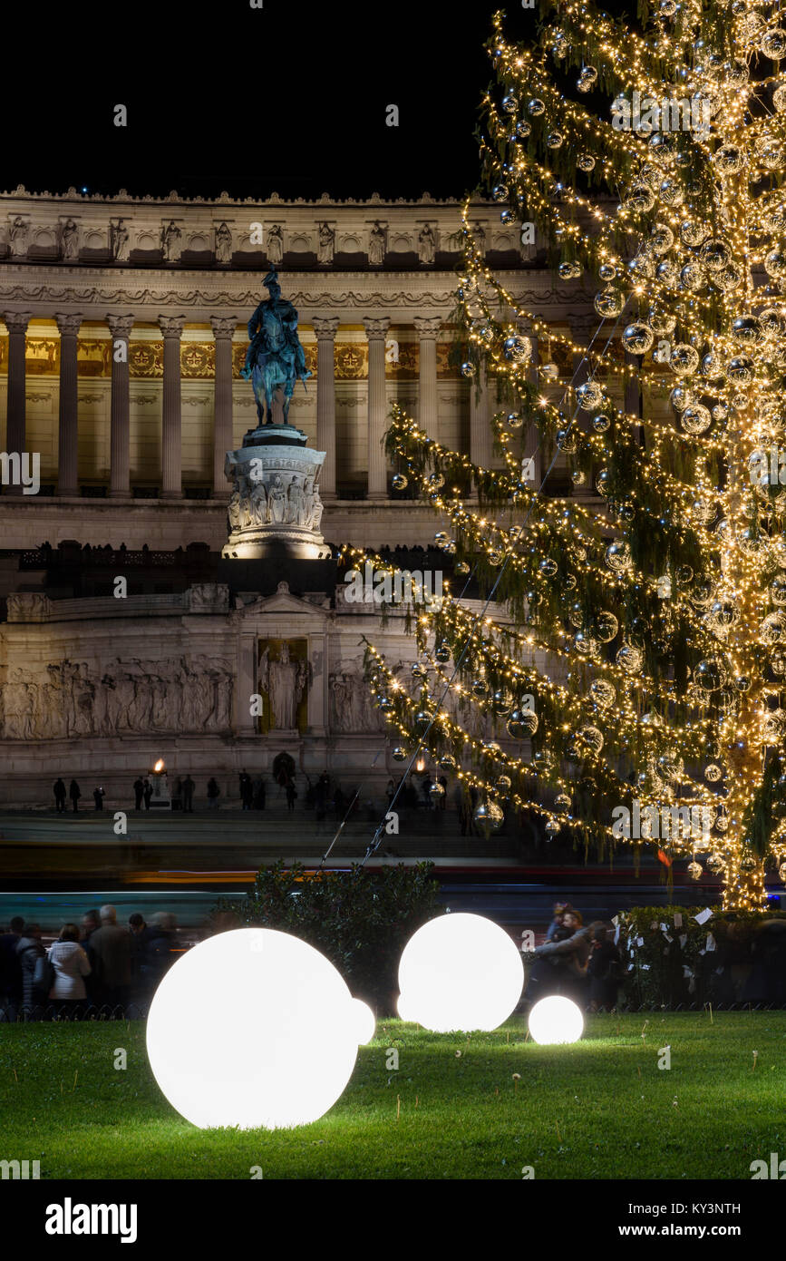 Details of The Christmas Tree of Rome 2017 called Spelacchio, in Piazza Venezia with the monument of the altar of fatherland on background. Stock Photo