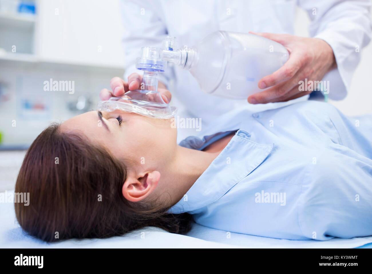 Young woman with resuscitation mask covering mouth Stock Photo Alamy