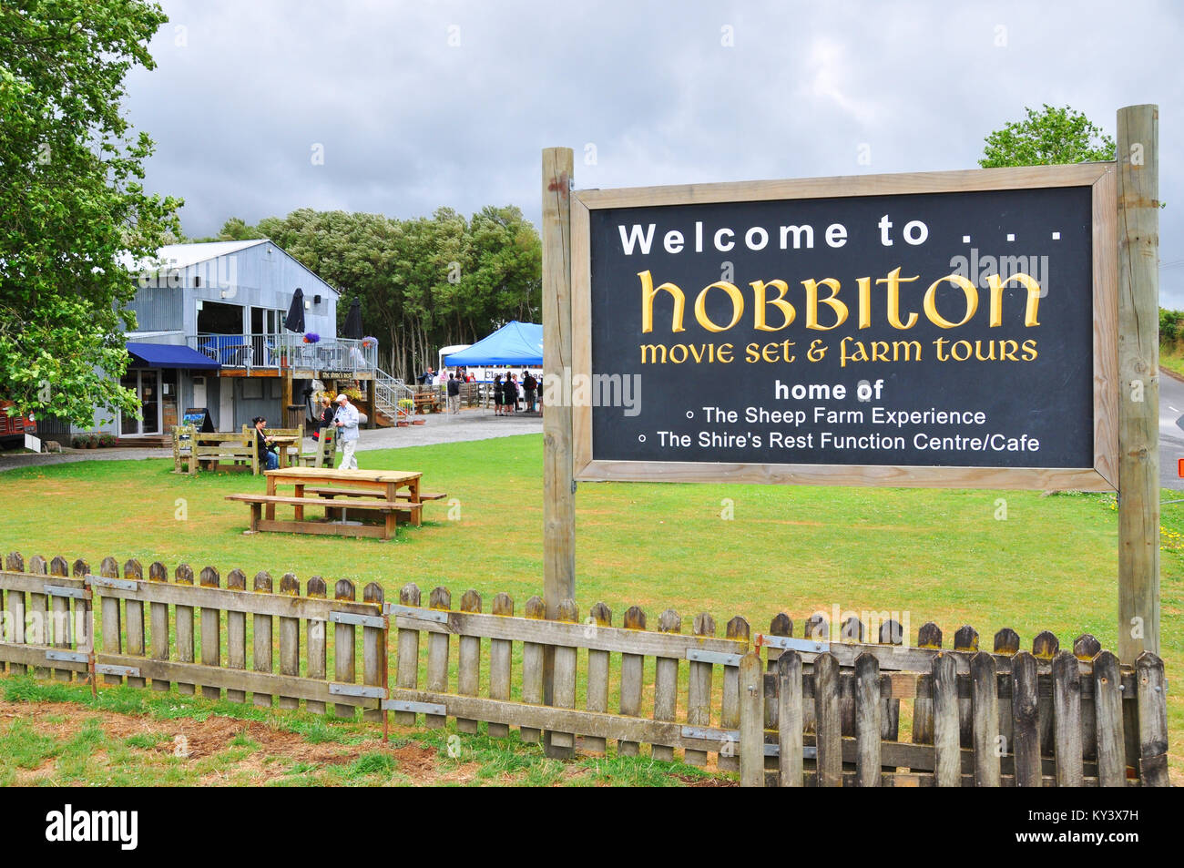 Hobbiton movie set visitor attraction in farmland near Matamata New Zealand. Visitor Centre sign and building. Space for copy Stock Photo