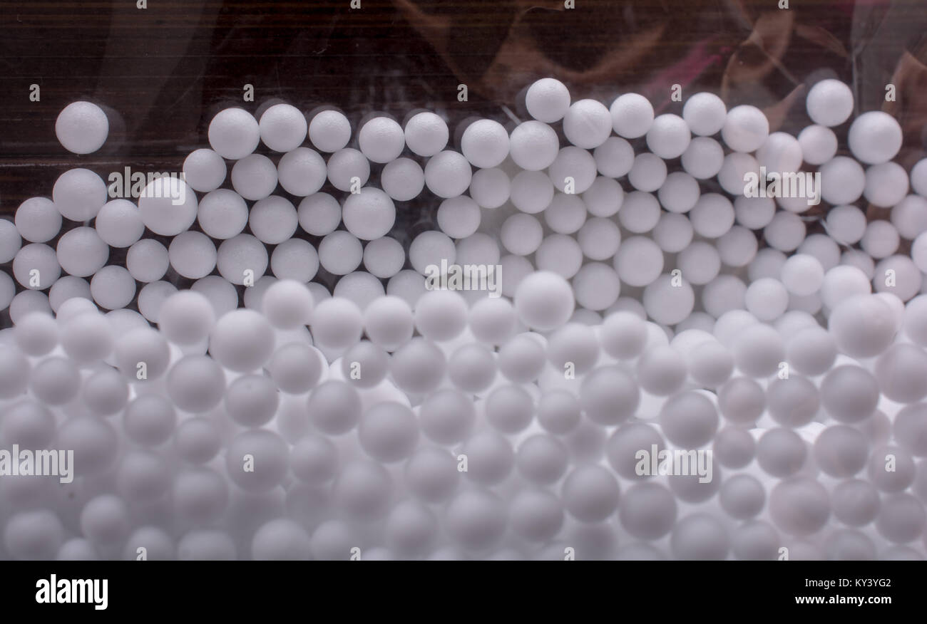 White little polystyrene foam balls as background Stock Photo - Alamy