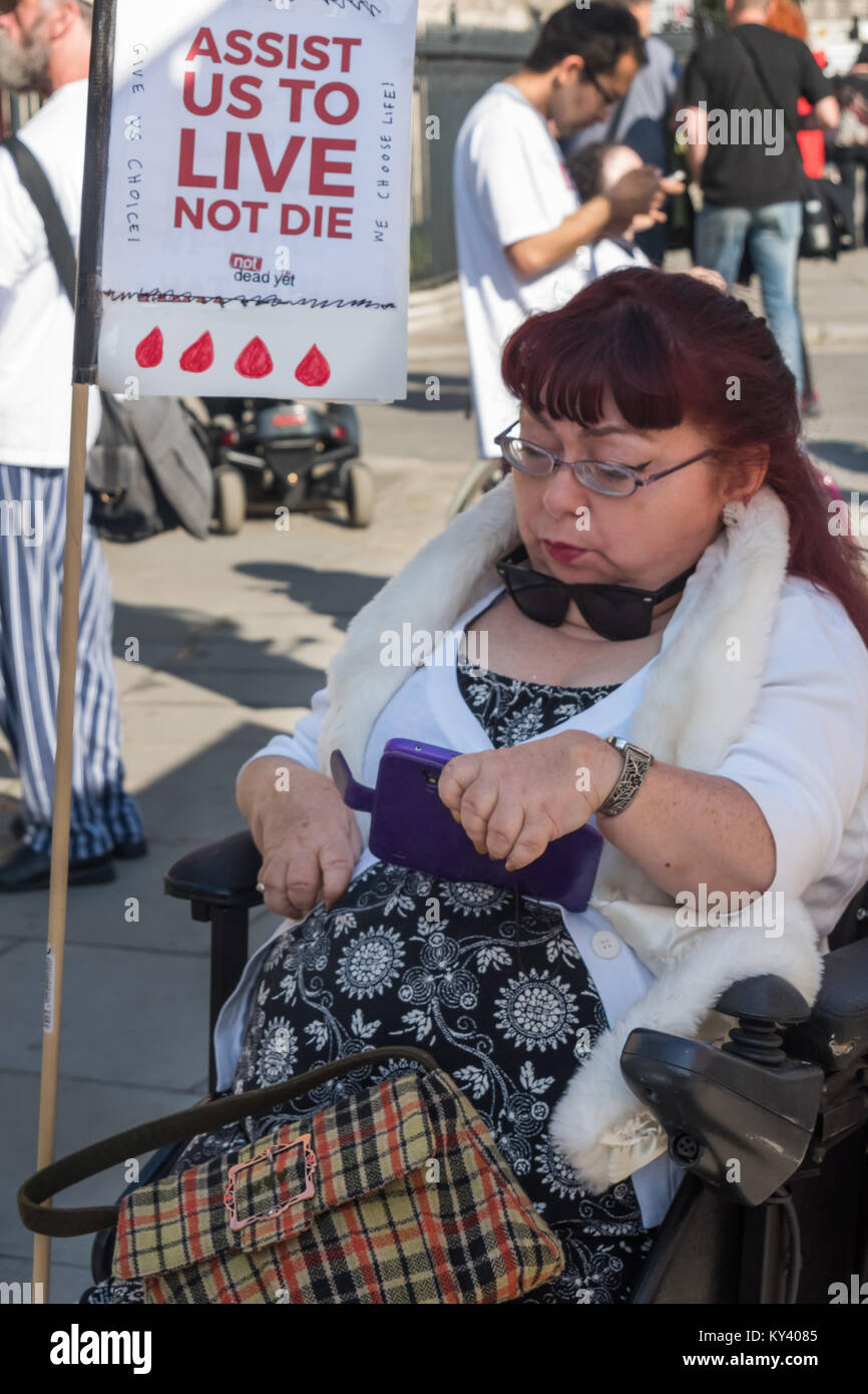 A disabled woman at the protest in Old Palace Yard against the Assisted Suicide Bill being debated in Parliament Stock Photo