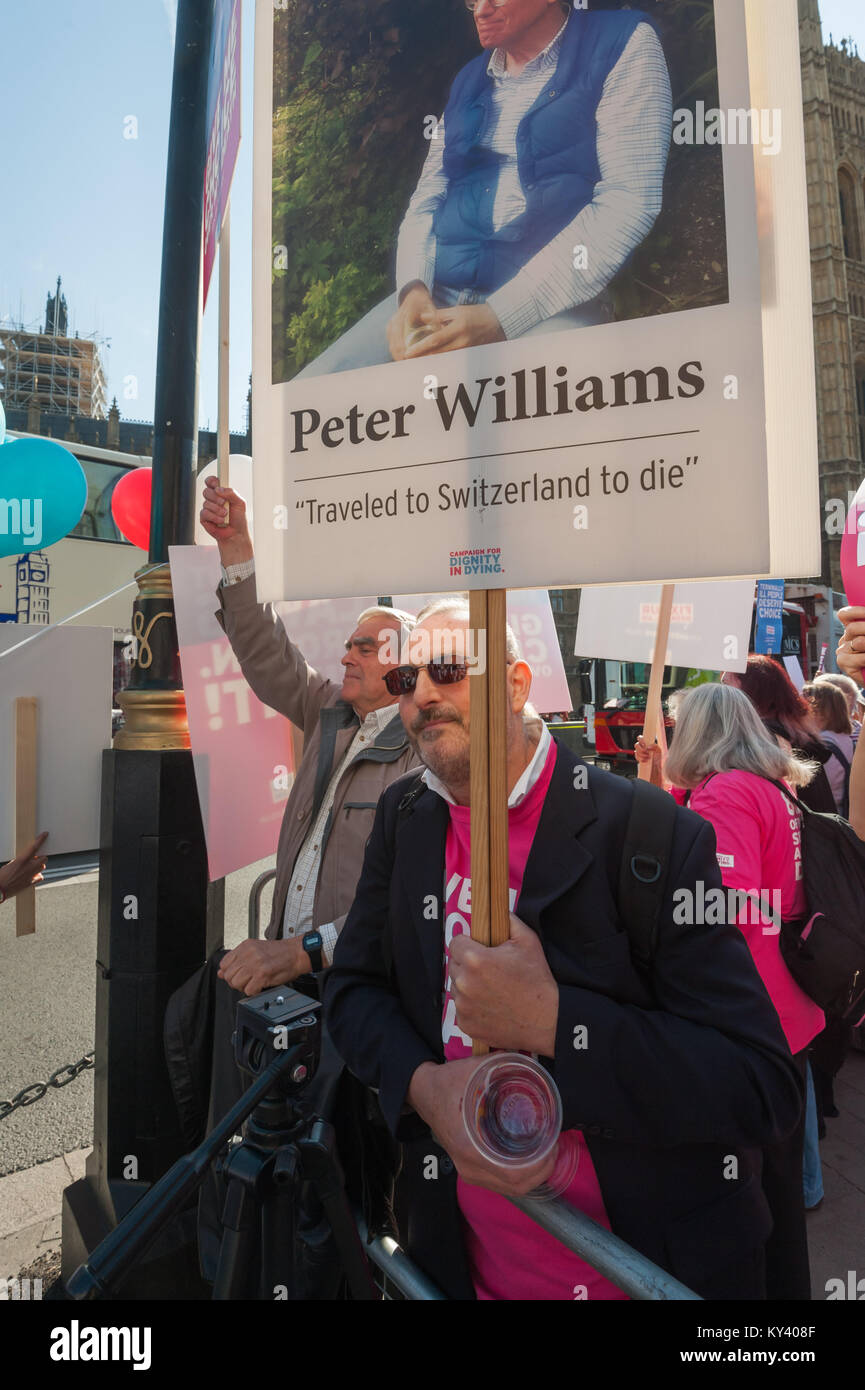 A supporter of the Assisted Suicide Bill being debated in Parliament holds a picture of Peter Williams who travelled to Switzerland to die. Stock Photo