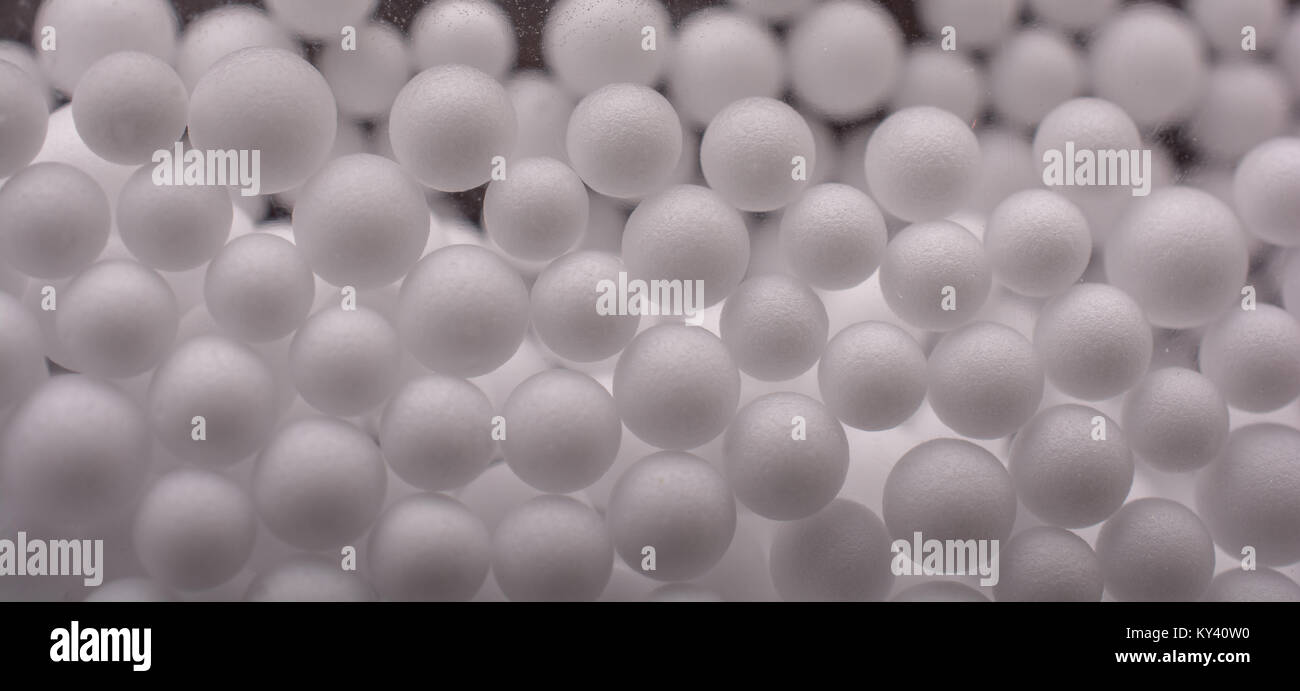 White little polystyrene foam balls as background Stock Photo - Alamy