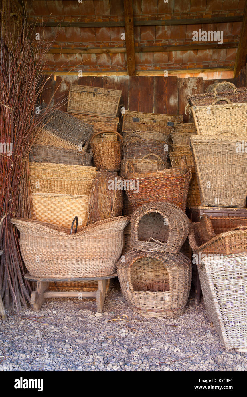 Different history wicker baskets in the old barn Stock Photo Alamy