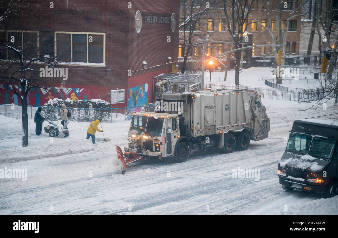 Snowplows in the Chelsea neighborhood of New York on Thursday, January 4, 2017 during the first nasty winter storm of the new year. Mother Nature is predicted to dump 5 to 8 inches of snow in the city and to make matters worse, is adding gusty winds into the mix. The snow will be followed by single digit temperatures guaranteeing that the mounds of the white stuff will never melt. (© Richard B. Levine) Stock Photo