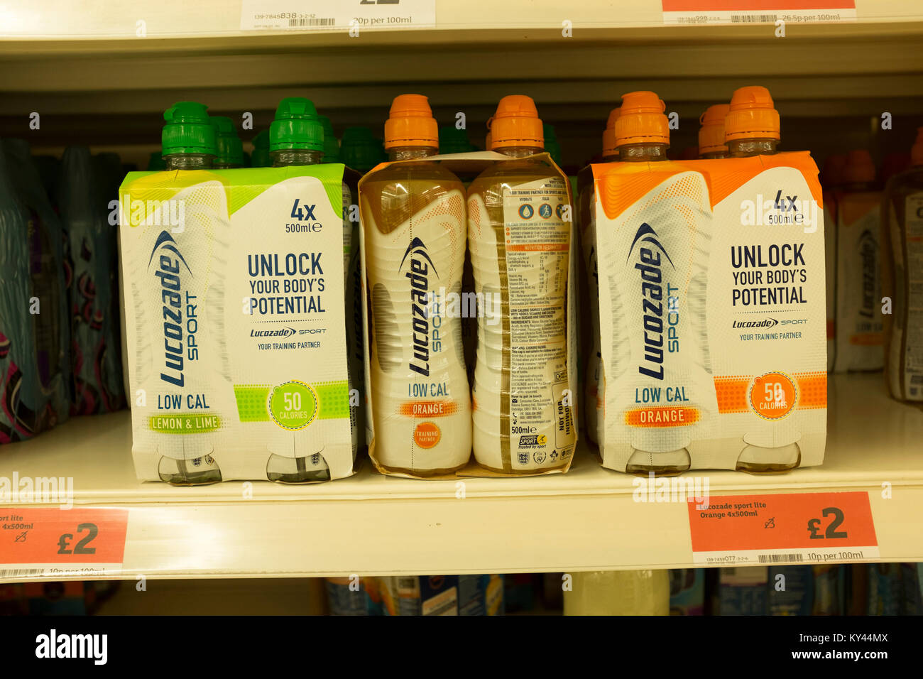 Low calorie Lucozade Sport drink bottles on display in supermarket shelves, UK Stock Photo