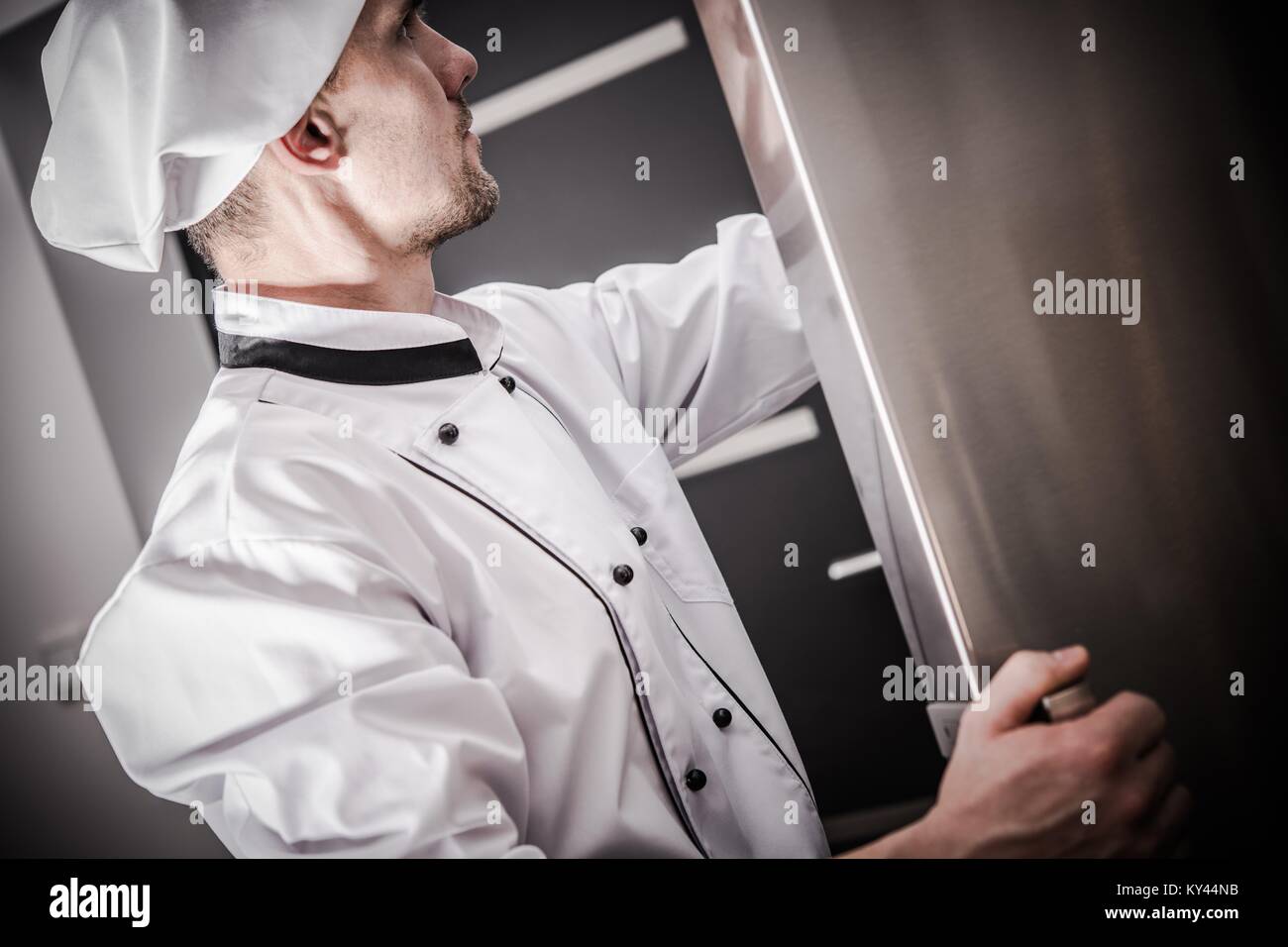 Proper Restaurant Food Storage. Caucasian Chef in His 30s Checking on