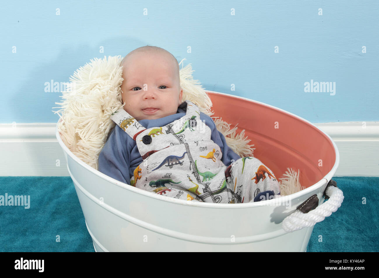 baby boy 2 months old relaxing in vintage tin bath tub Stock Photo