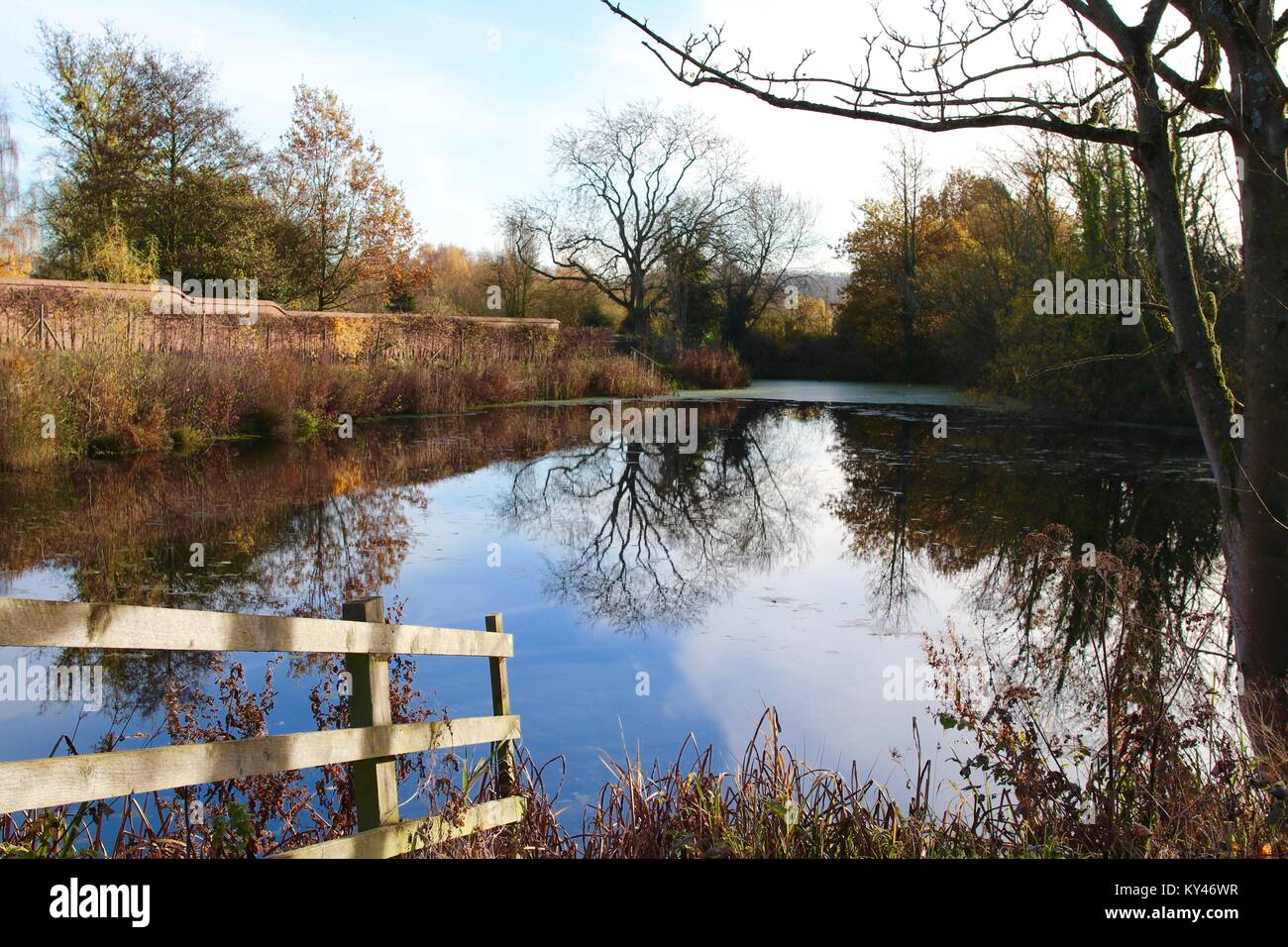 Tranquil winter water scene with reflections Stock Photo