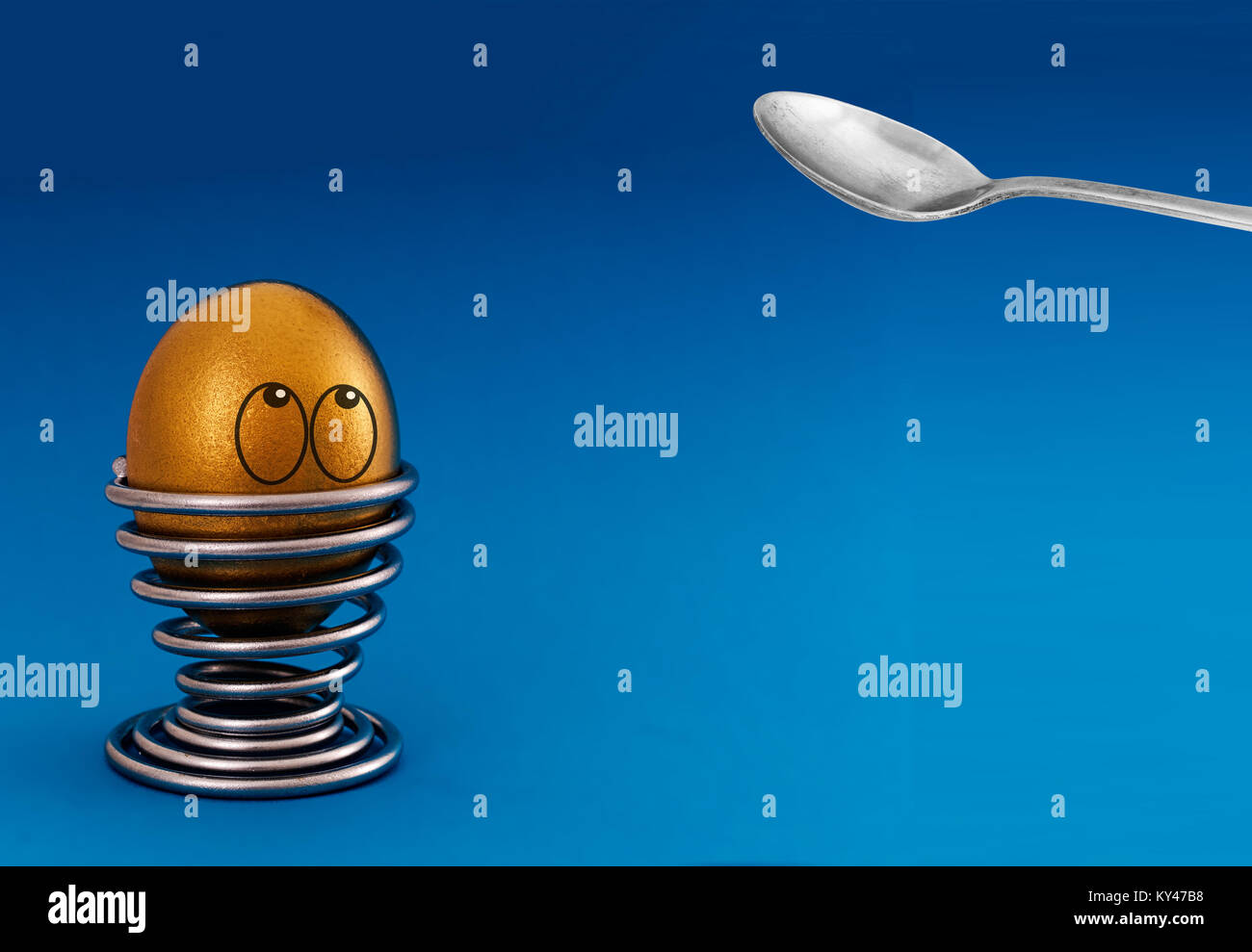 Cracking gold egg. Financial investment metaphor. Stock Photo