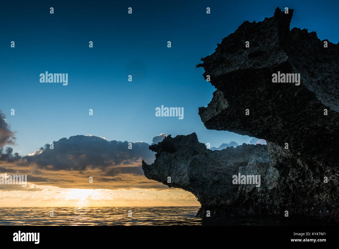 View to big volcanic rocks in sunset lights in San-Andres island, Caribbean. Stock Photo
