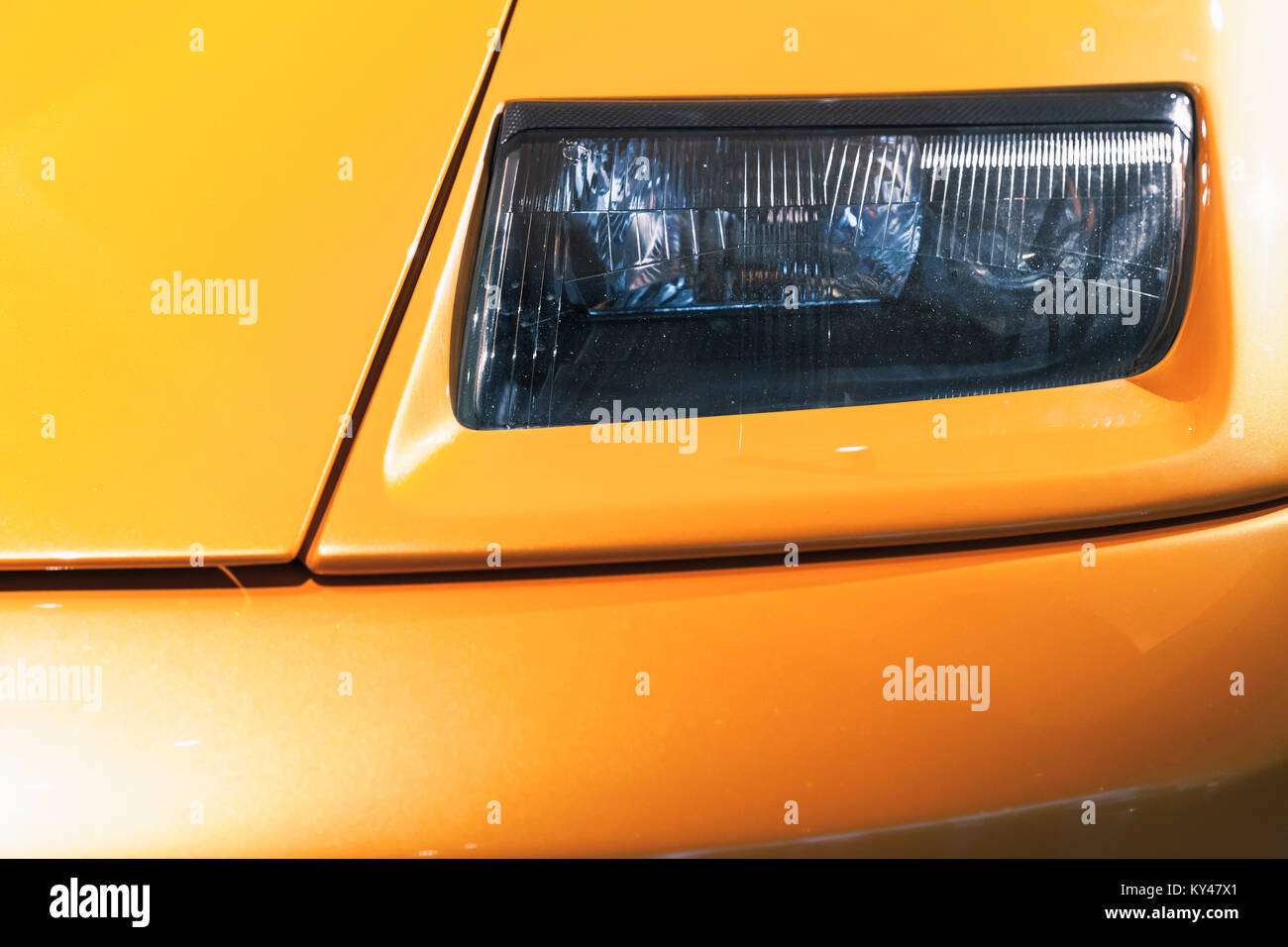 Headlight design on a luxury yellow sports car Stock Photo Alamy