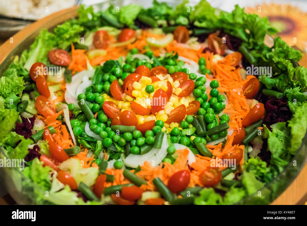 Close-up bowl filled with fresh vegetarian salad. Stock Photo