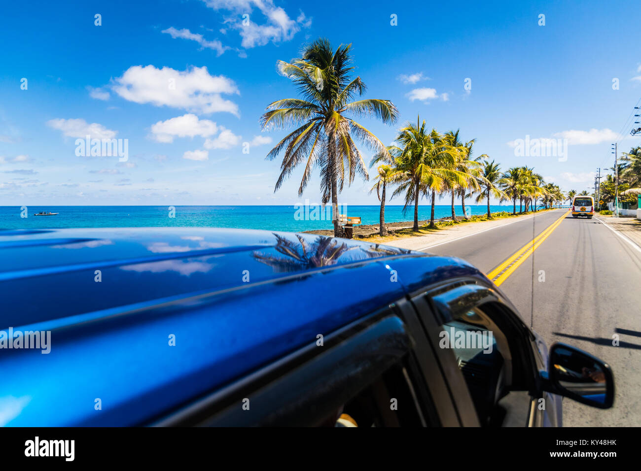 View to sunny street from above a car in Caribbean San-Andres island. Stock Photo
