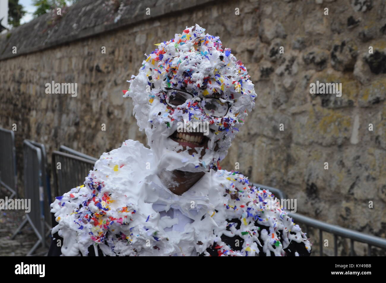 Students leaving their last exam meet friends for a traditional 'trashing' at the back of Oxford University Examination School, Oxford, England, UK. Stock Photo