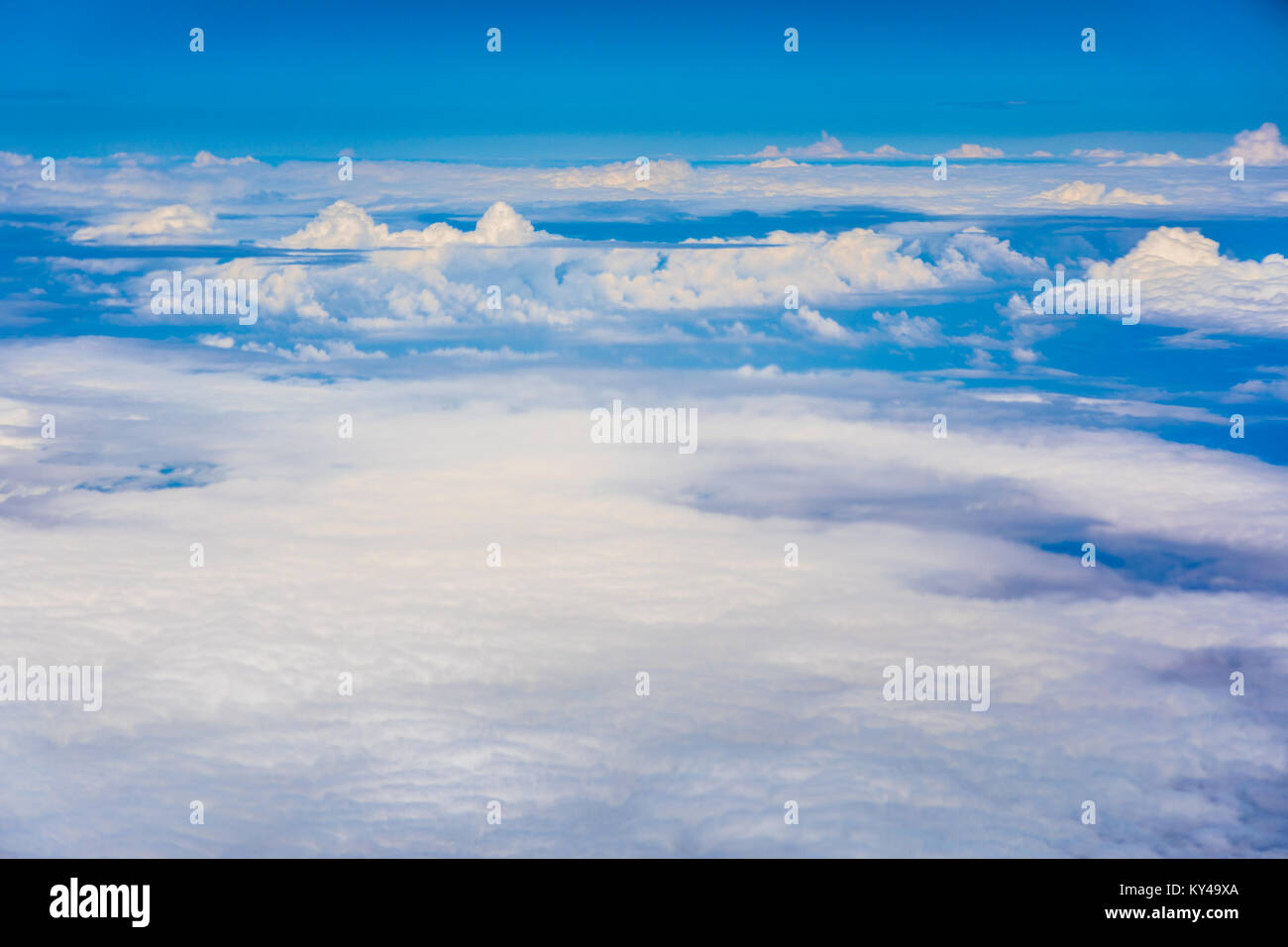 Aerial view to blue sky and cloudscape from a jet. Stock Photo