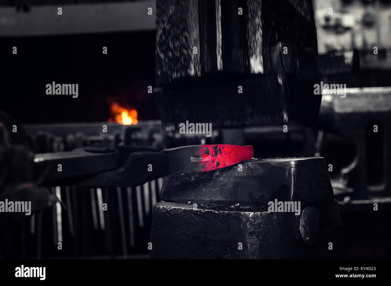 Blacksmith at work, hit with a hammer by a hot metal on the anvil Stock