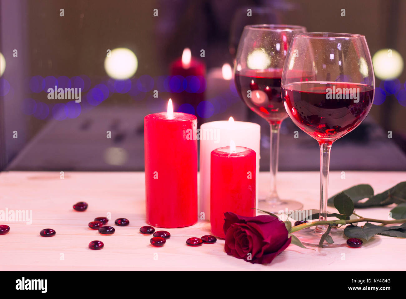 The concept of St. Valentine's Day with wine and candles Stock Photo