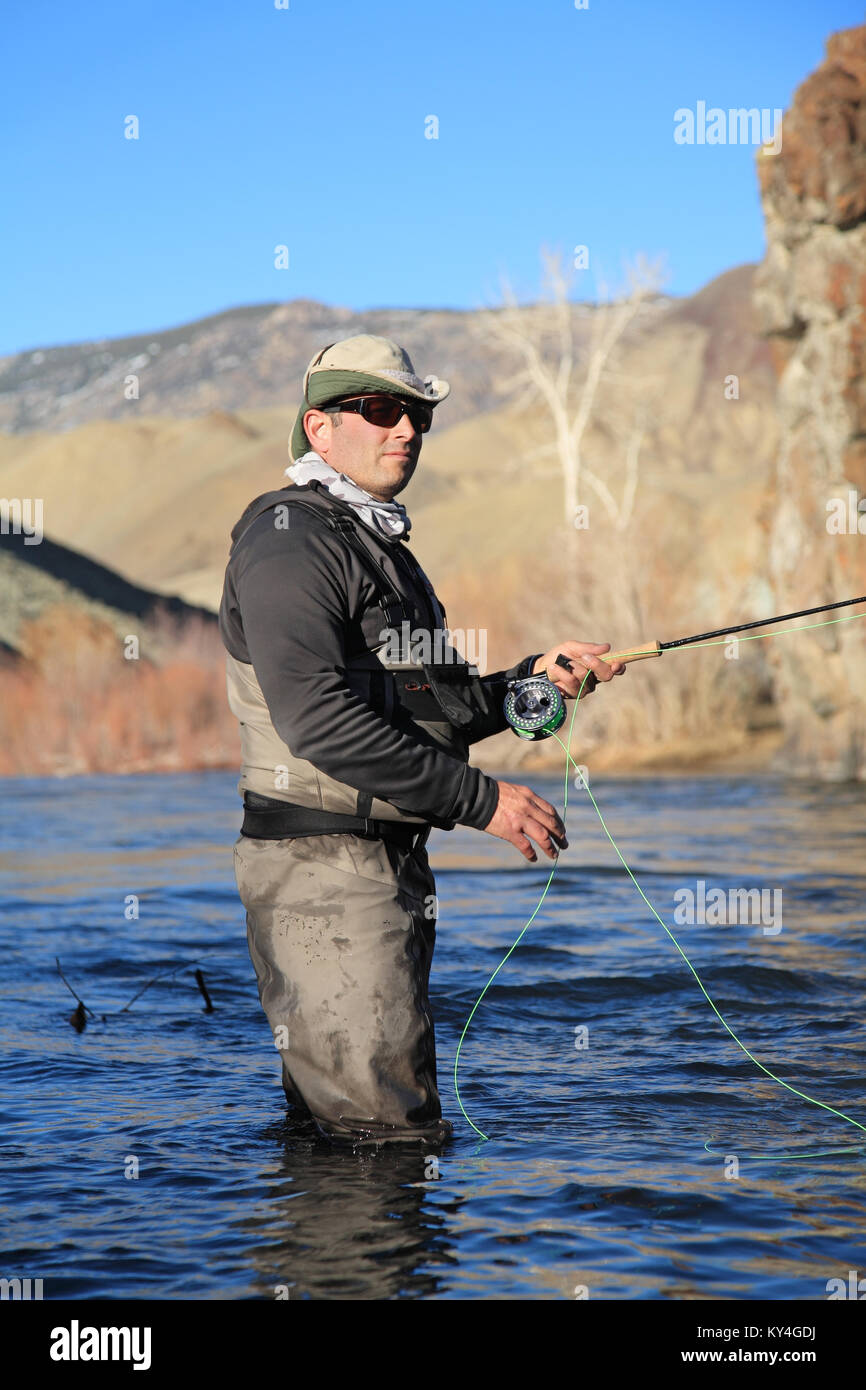 fly fisherman fishing on the Salmon River in Idaho, USA Stock Photo
