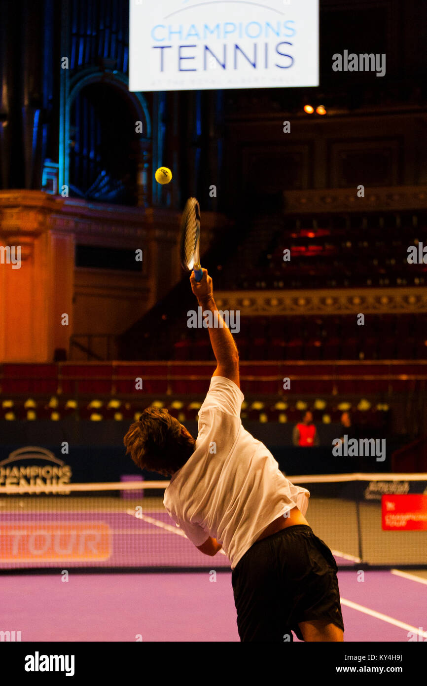 London, UK. A player practices his serve prior to the launch of Champions' Tennis at the Royal Albert Hall. Stock Photo