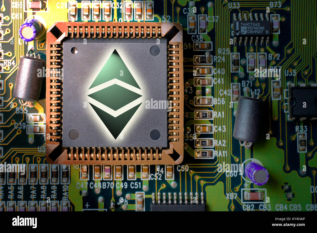 Virtual cryptocurrency and blockchain - financial technology and internet money - circuit board mining and coin Ethereum Classic (ETC) Stock Photo