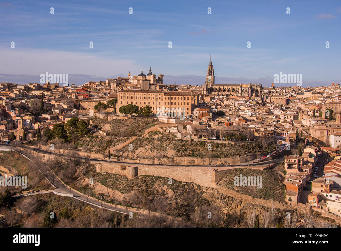 Panoramic view of the city walls of Toledo, medieval buildings and Saint Mary's Cathedral. Spain. Stock Photo