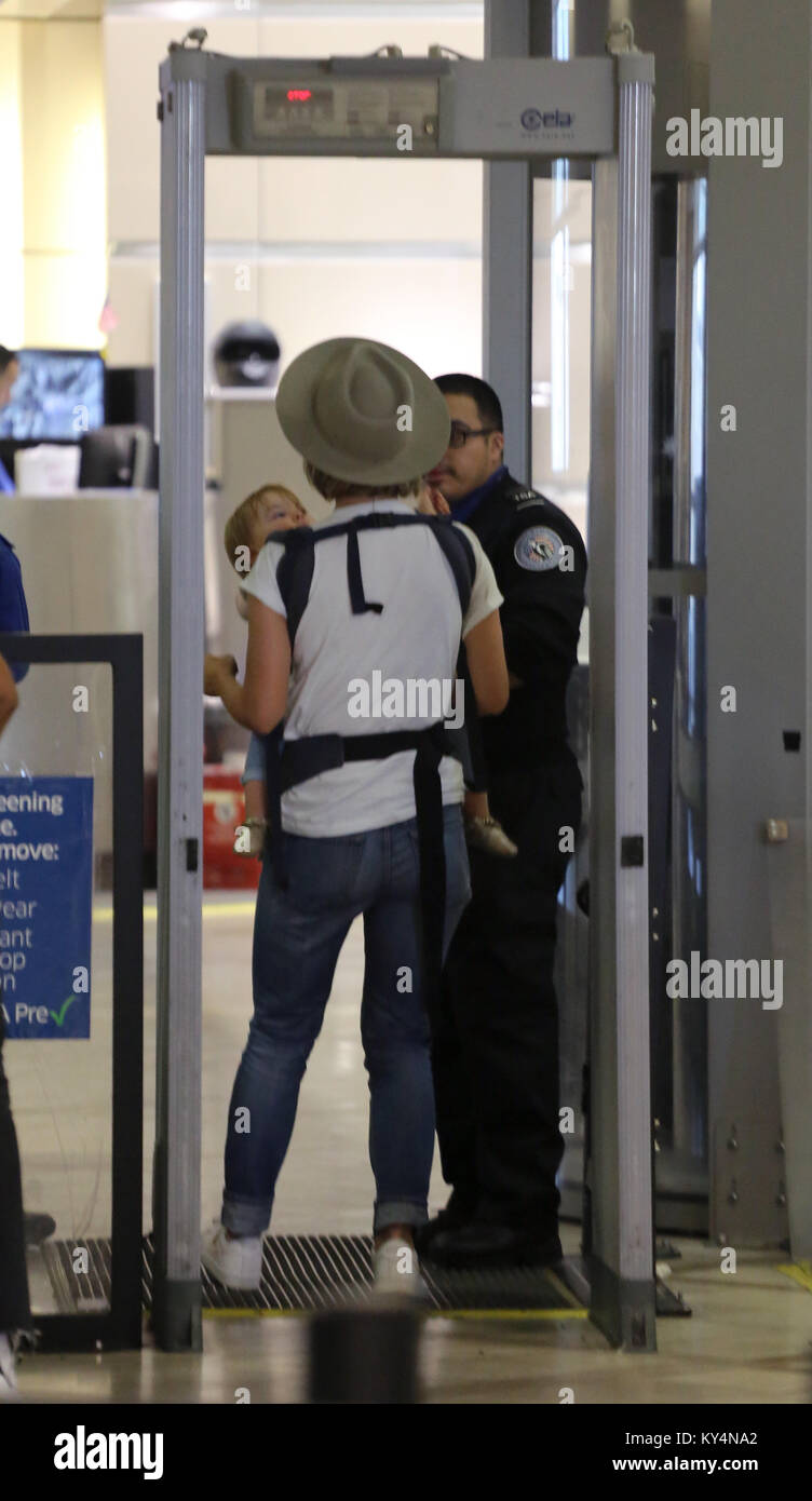 Olivia Wilde and Jason Sudeikis arrive at LAX Airport with their kids