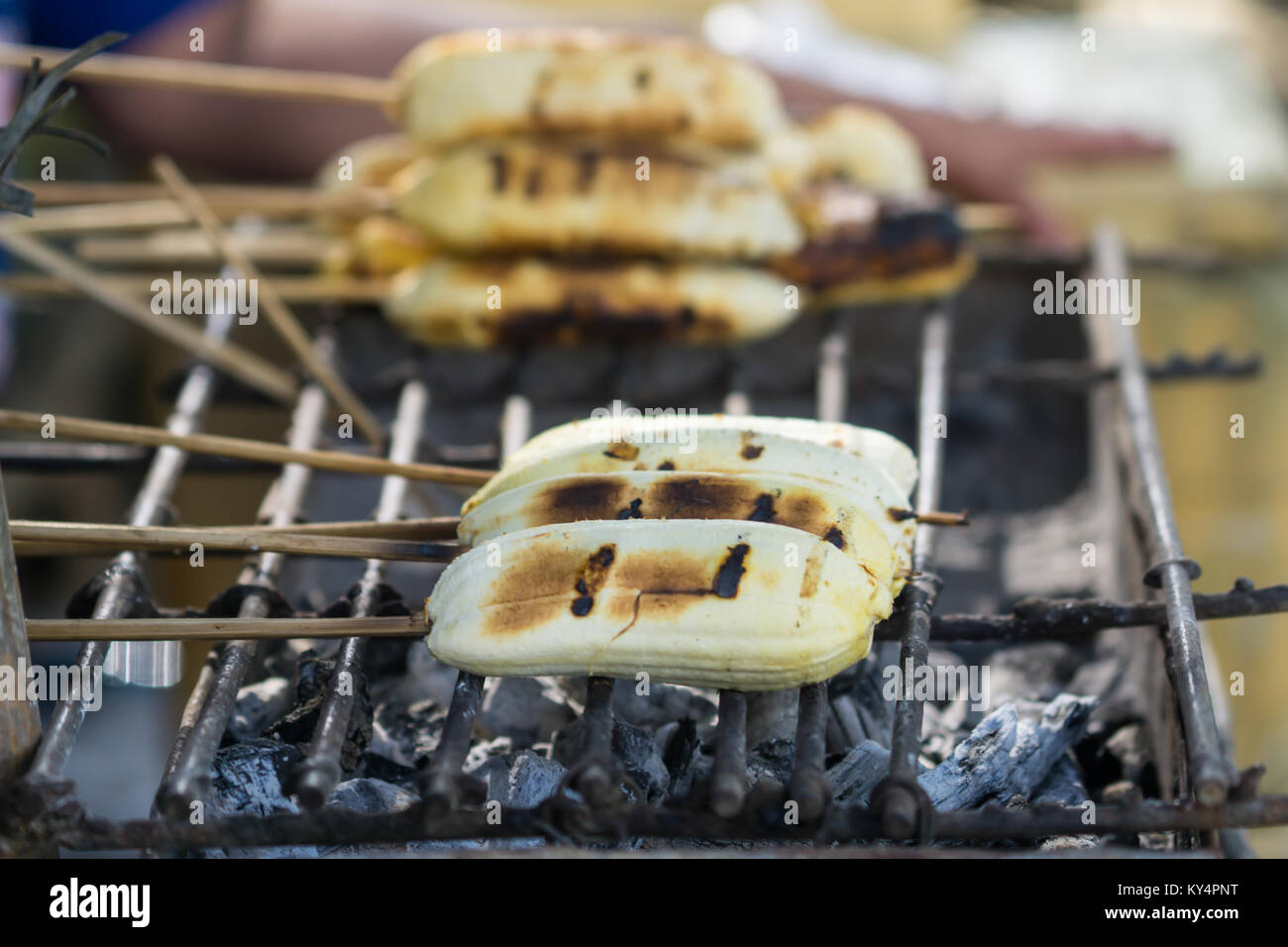 Grilled bananas,a favourite snack street food in the Philippines known as Ginanggang Stock Photo
