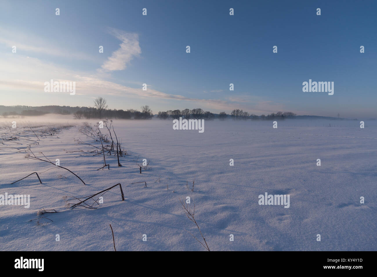 Snowy winter landscape with clear sky Stock Photo