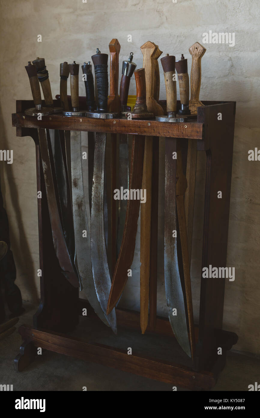 Sword arranged on wooden rack Stock Photo - Alamy