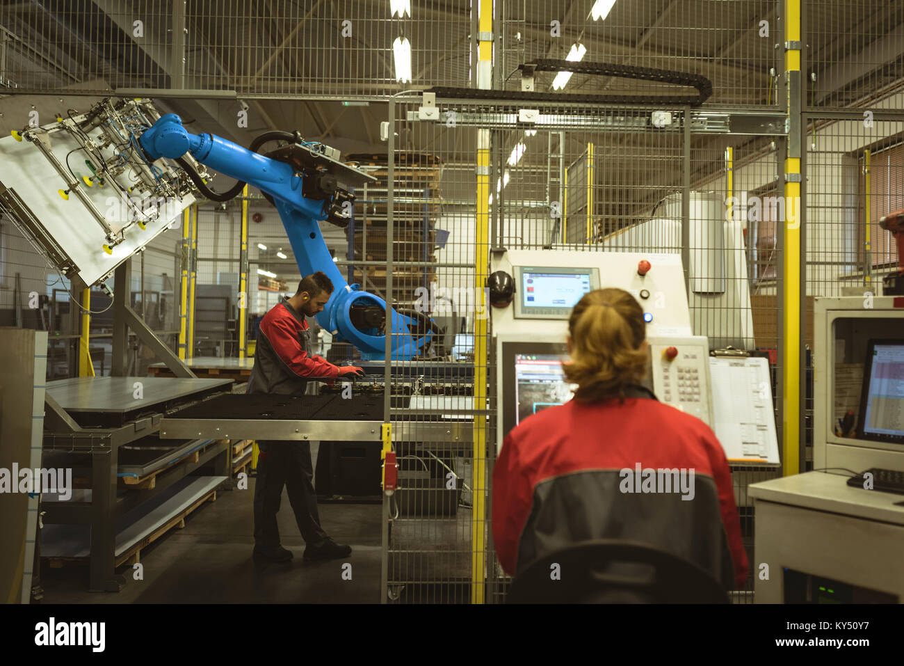 Female worker operating machine Stock Photo