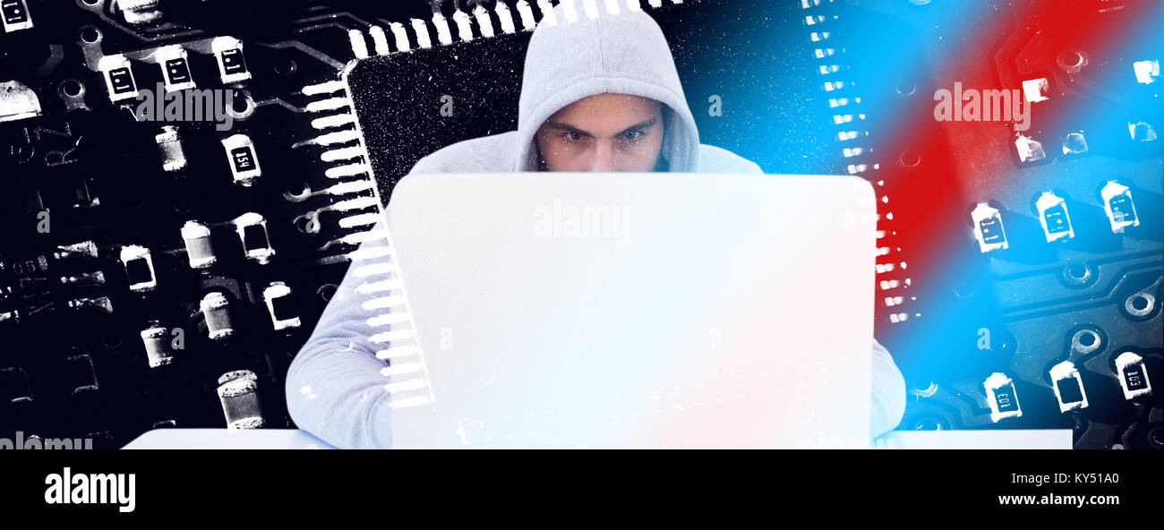 Composite image of serious burglar hacking into laptop Stock Photo