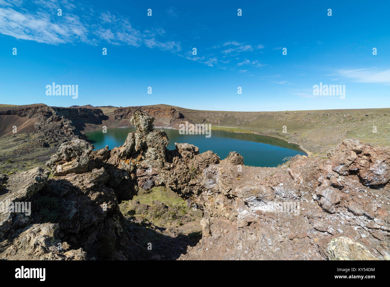 Laguna Azul, a water-filled extinct volcanic crater that is home to many birds, on the southern border of Argentina, near Rio Gallegos. Stock Photo