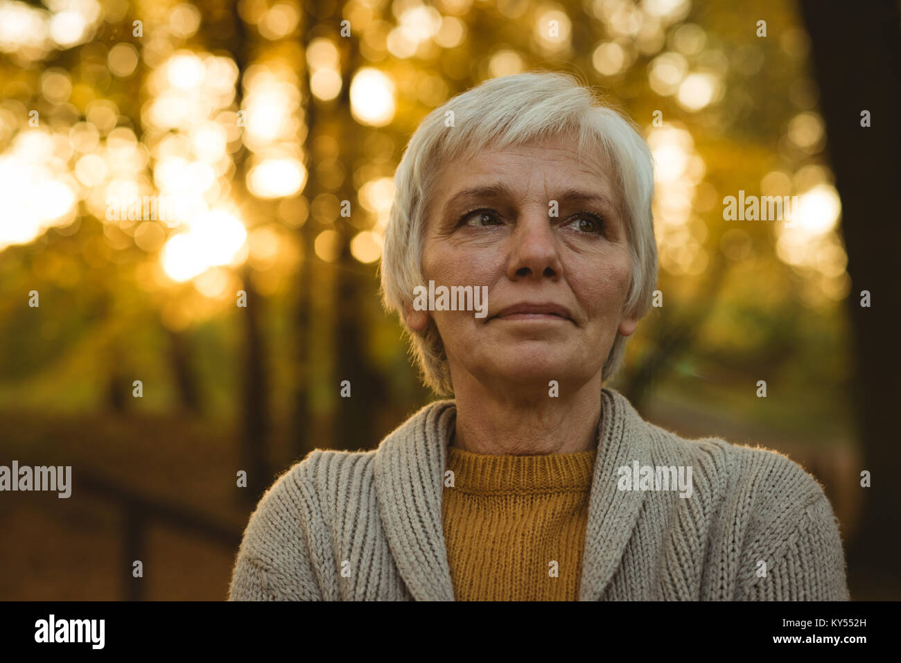 Thinking orange senior woman hi-res stock photography and images - Alamy