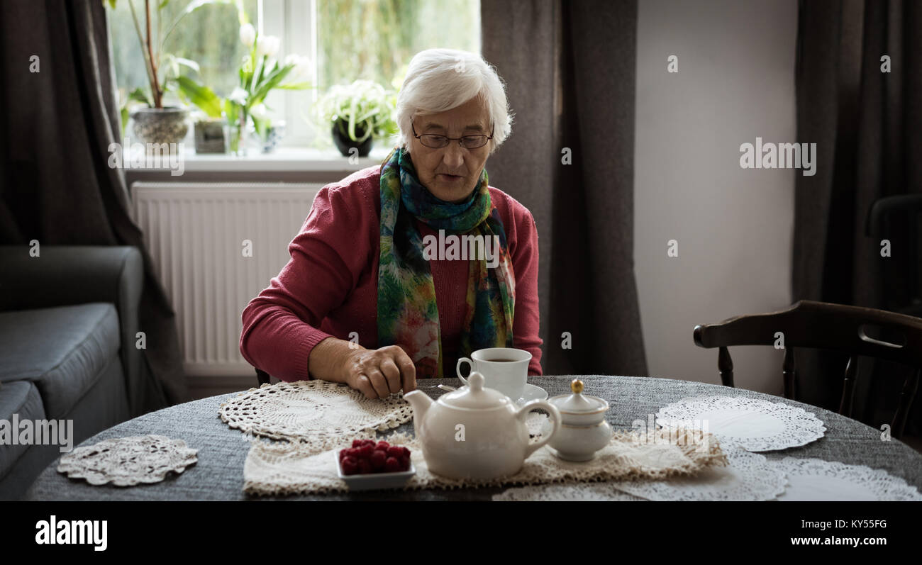 Senior woman having cup of tea Stock Photo