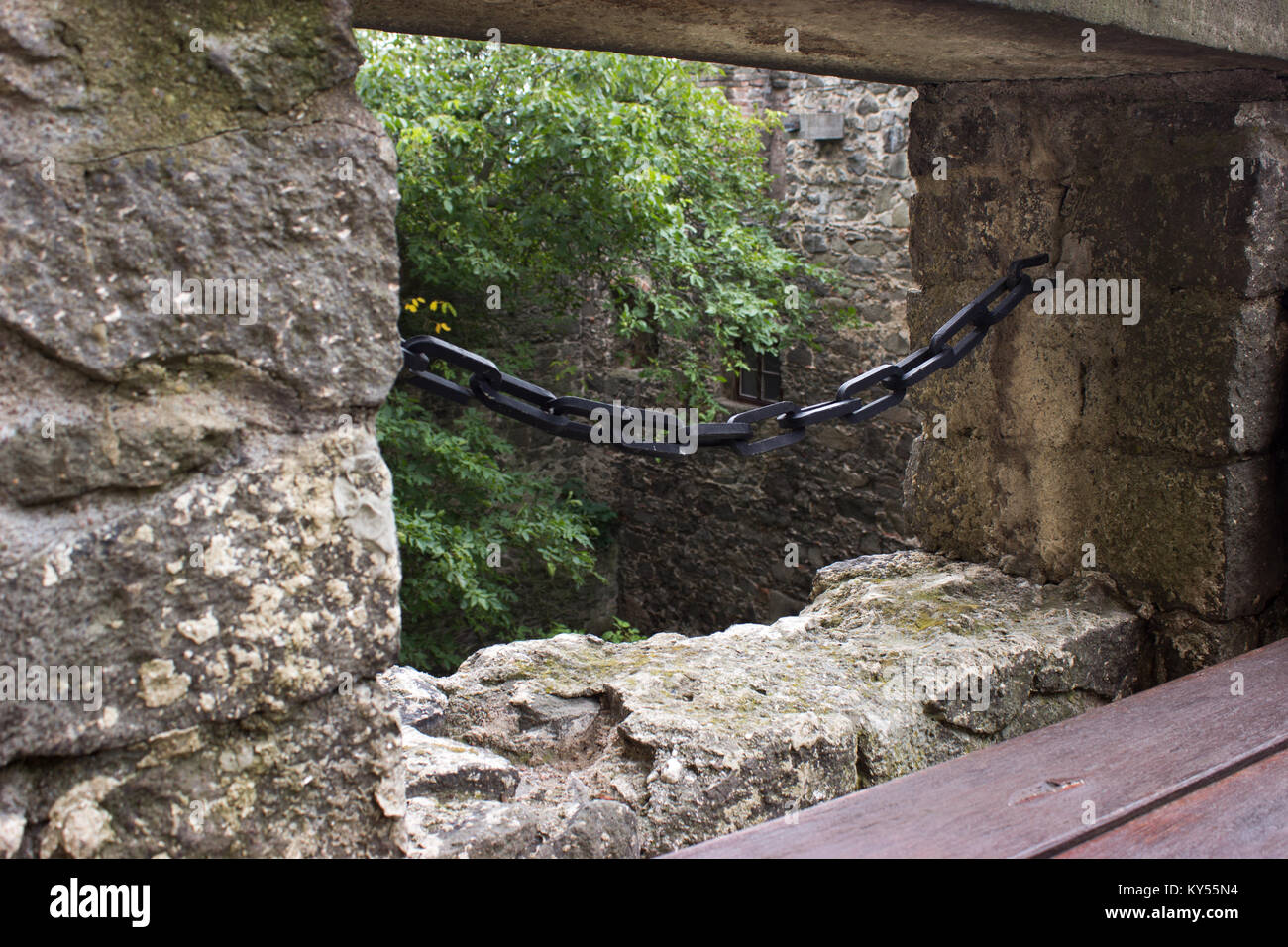 View over the loophole protected chain in the castle. In the foreground is a wooden bench. Stock Photo
