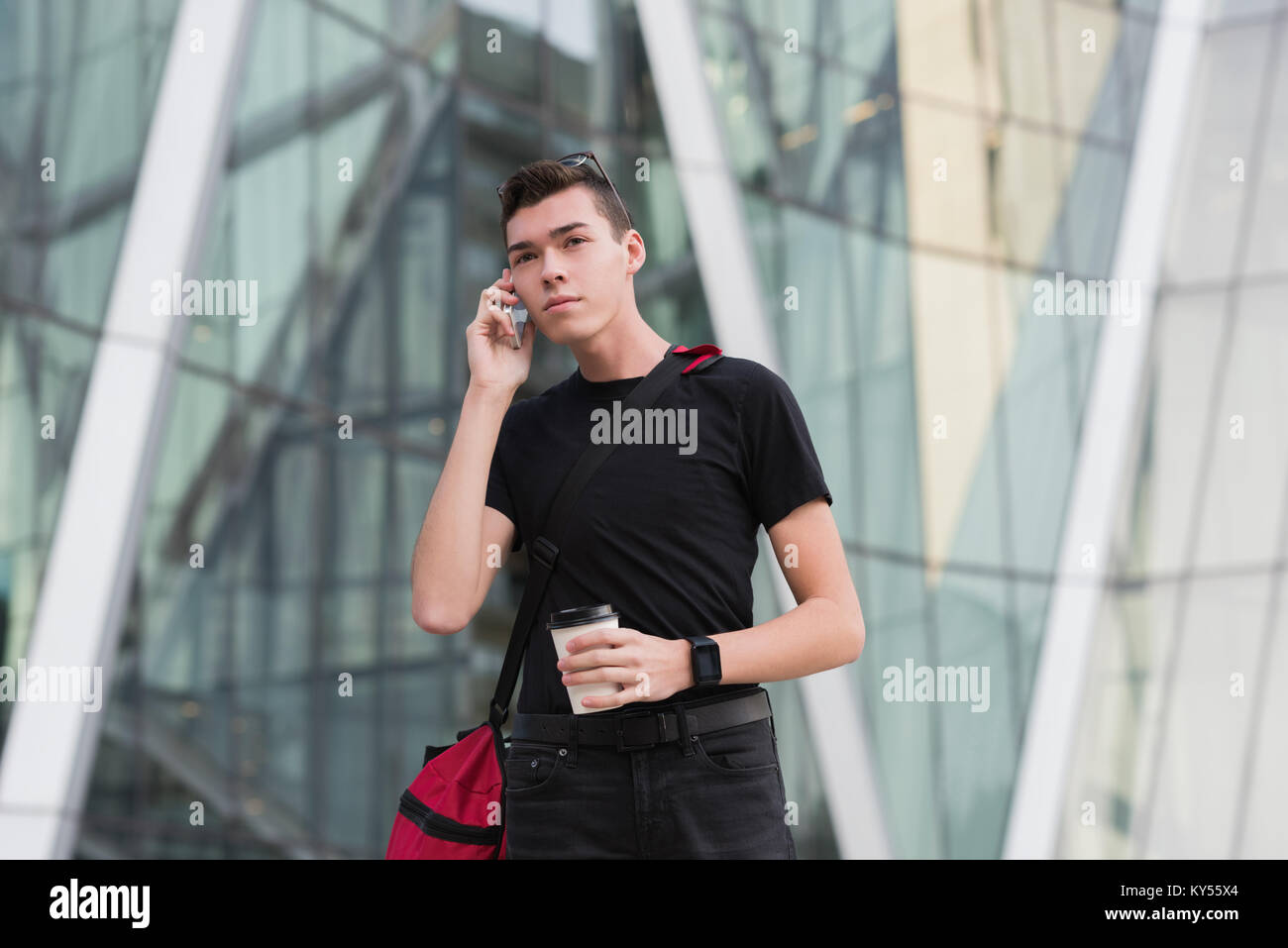 Man talking on mobile phone while having coffee Stock Photo