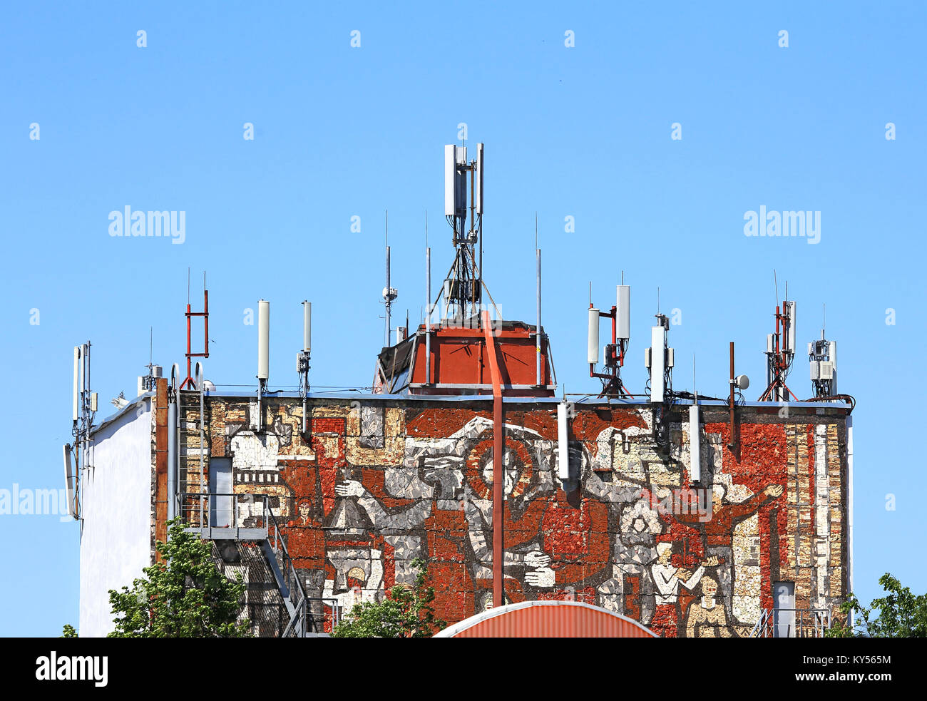 Antenna of cellular communication on the roof of the building Stock Photo