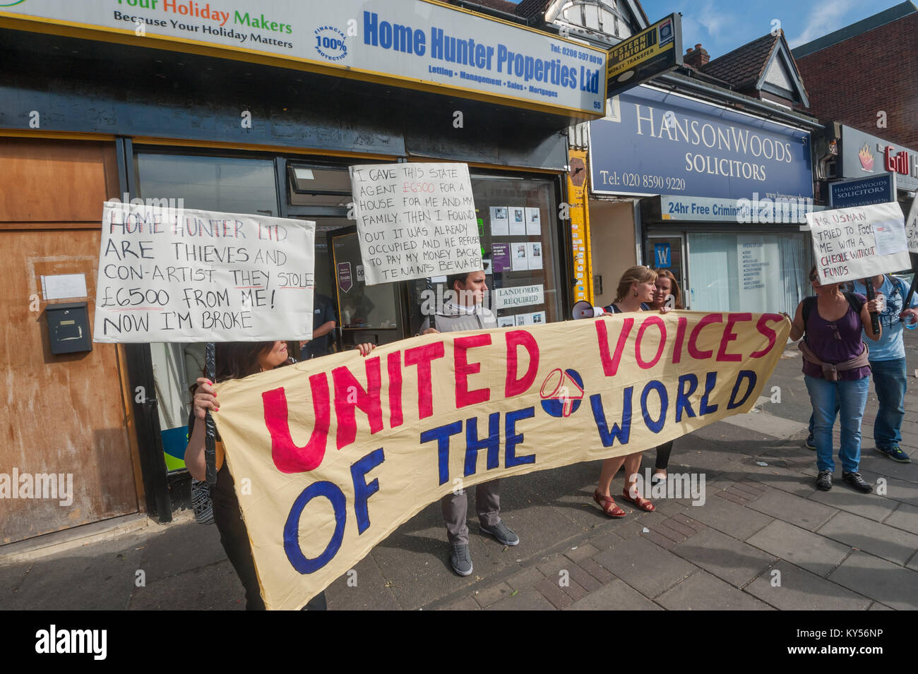 United Voices of the World keep up a noisy protest outside Home Hunter Properties Ltd, attracting a great deal of local attention and sympathy for Carlos while talks go on inside. Stock Photo