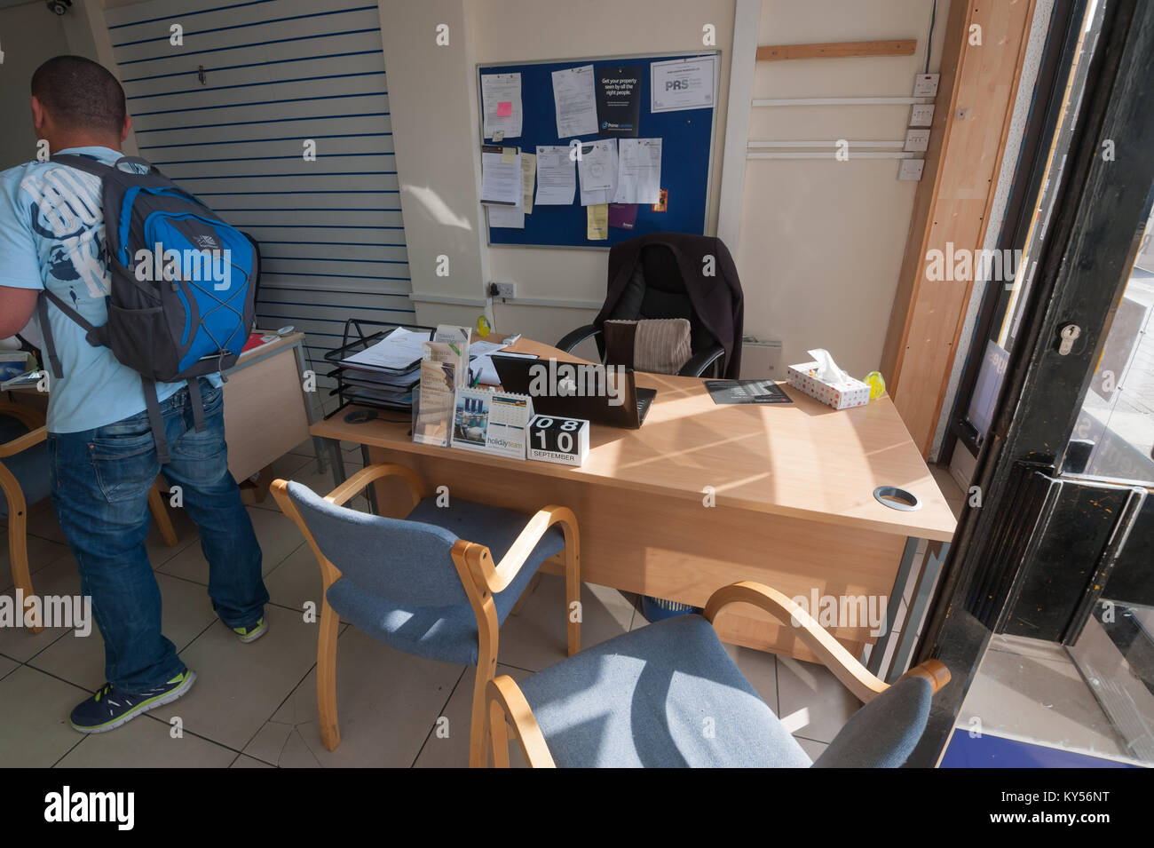 This single desk by the window is the office of Hunter Home Properties Ltd. Stock Photo