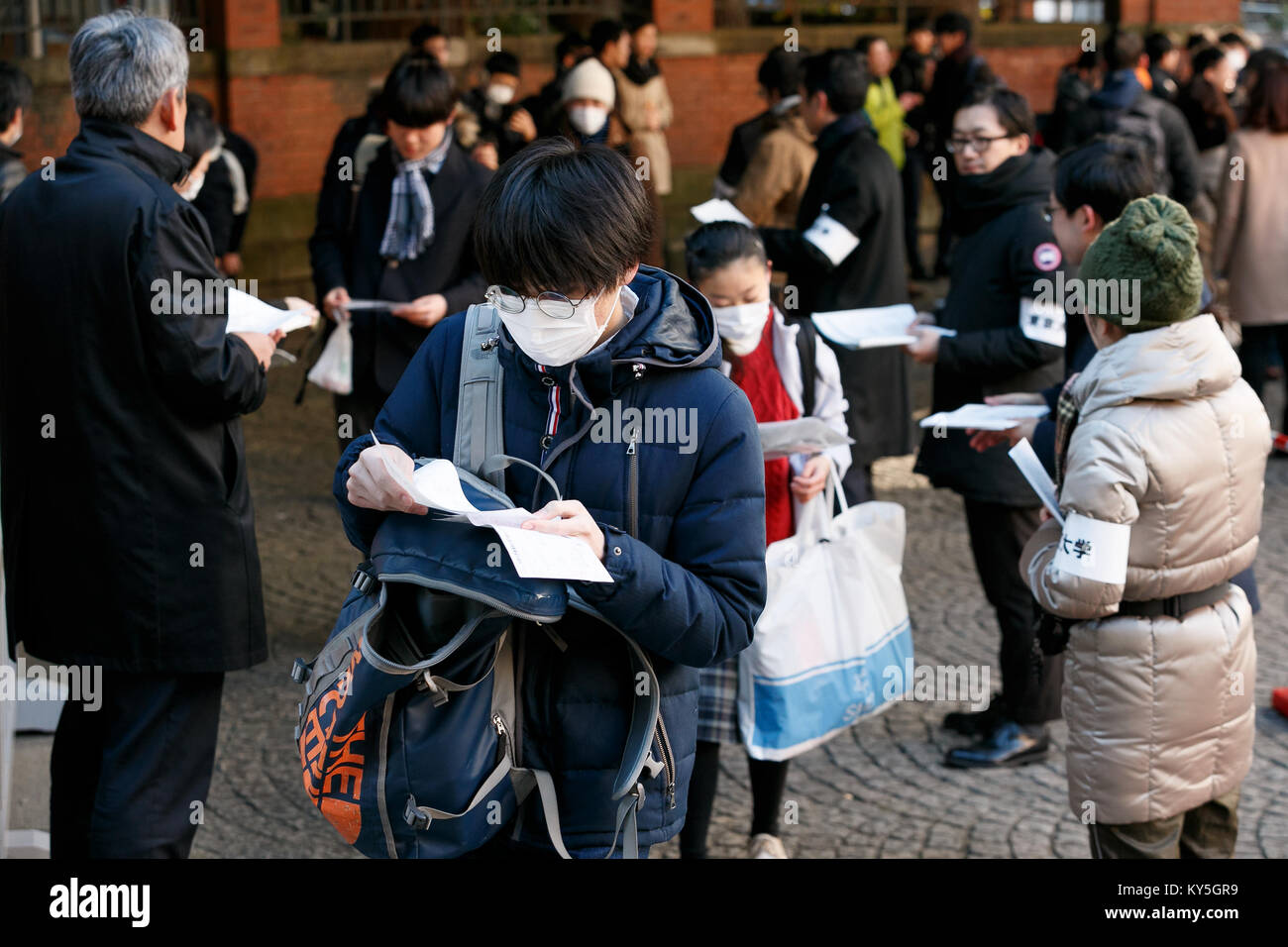 Tokyo, Japan. January 13, 2018. Japanese students arrive at the University of Tokyo to take the national university admission tests on January 13, 2018, Tokyo, Japan. This year, 582,617 students will take the tests at 695 test centers located across the nation over this weekend. Credit: Rodrigo Reyes Marin/AFLO/Alamy Live News Stock Photo