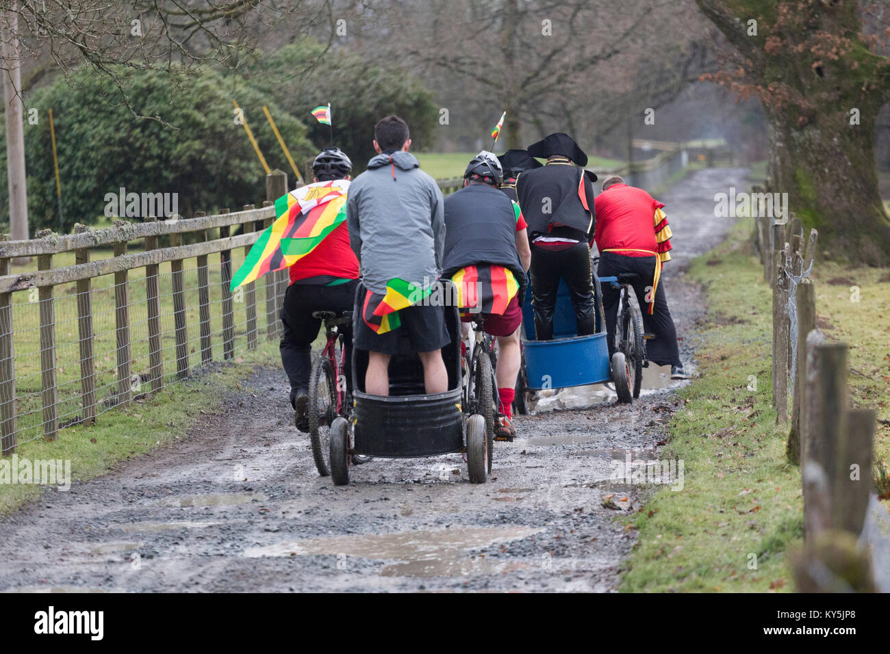 Competitors race mountain bike chariots in the annual Llanwrtyd Wells World Mountain Bike Chariot Race in Powys, Wales. Stock Photo