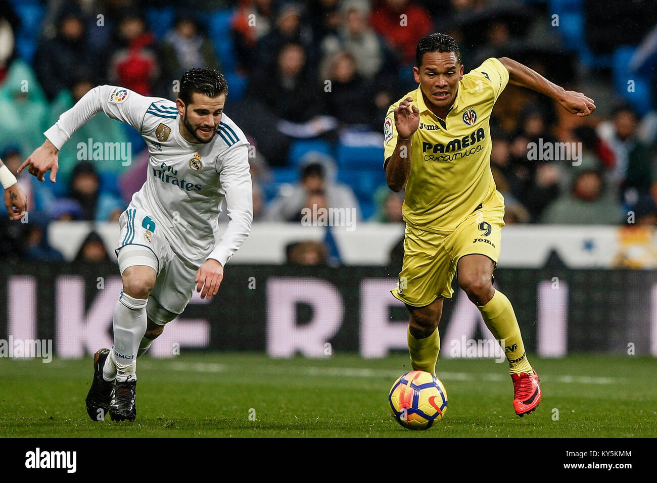 Carlos Bacca (Villerreal CF) fights for control of the ball Jose I. Fernandez, NACHO (Real Madrid), La Liga match between Real Madrid vs Villerreal CF at the Santiago Bernabeu stadium in Madrid, Spain, January 13, 2018. Credit: Gtres Información más Comuniación on line, S.L./Alamy Live News Stock Photo
