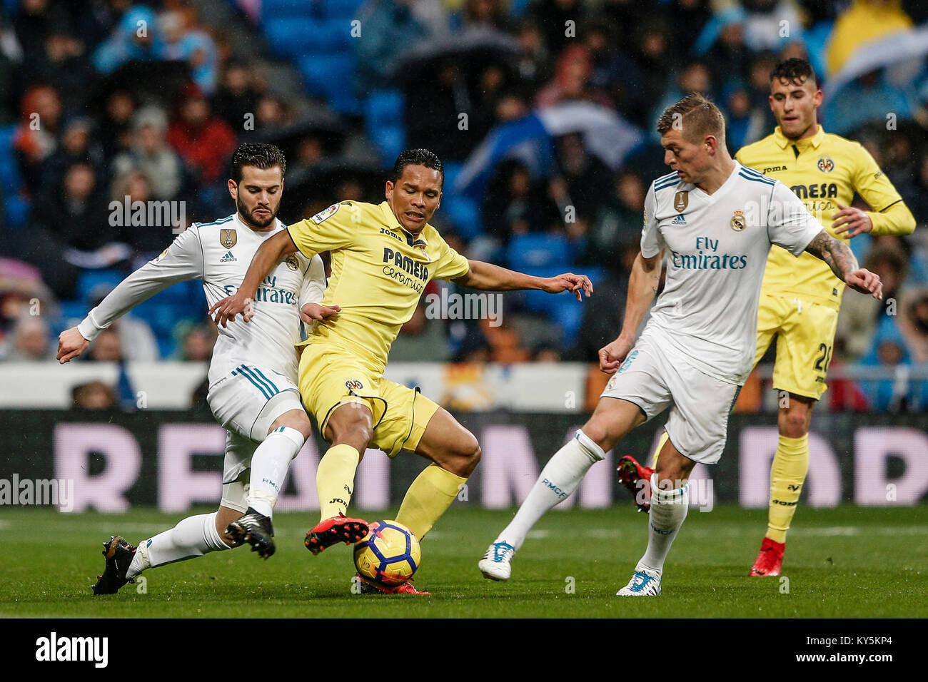 Carlos Bacca (Villerreal CF) fights for control of the ball Jose I. Fernandez, NACHO (Real Madrid), La Liga match between Real Madrid vs Villerreal CF at the Santiago Bernabeu stadium in Madrid, Spain, January 13, 2018. Credit: Gtres Información más Comuniación on line, S.L./Alamy Live News Stock Photo