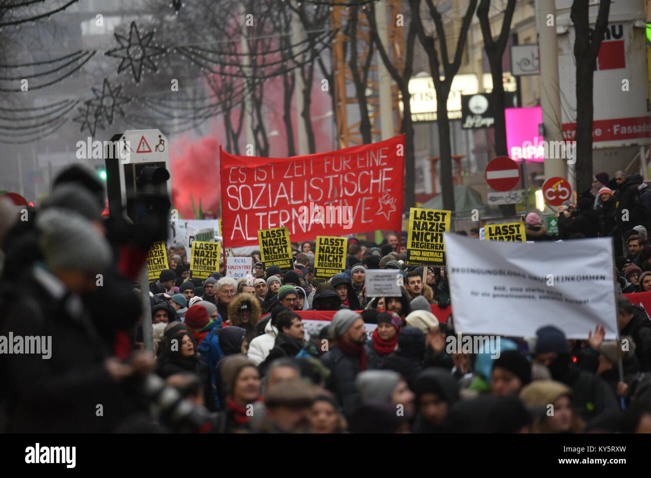 Vienna, Austria. 13th Jan, 2018. anti-government protesters marching underneath christmas decorations in Vienna's main shopping street. Credit: Vincent Sufiyan/Alamy Live News Stock Photo
