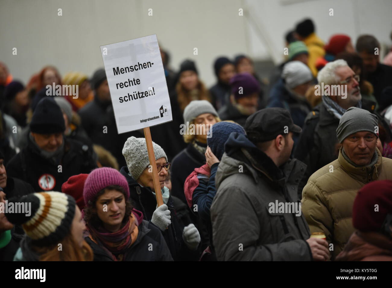 Vienna, Austria. 13th Jan, 2018. protester holding a sign demanding the protection of human rights during an anti-government demonstration. Credit: Vincent Sufiyan/Alamy Live News Stock Photo