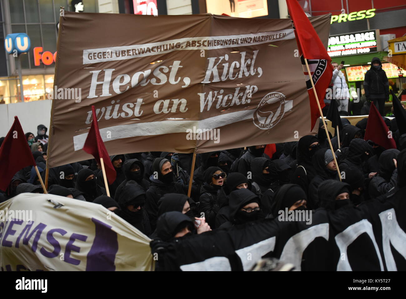 Vienna, Austria. 13th Jan, 2018. mummed protesters during an anti-government demonstration. the banner opposes Austria's interior minister Herbert Kickl from the right-wing freedom party. Credit: Vincent Sufiyan/Alamy Live News Stock Photo